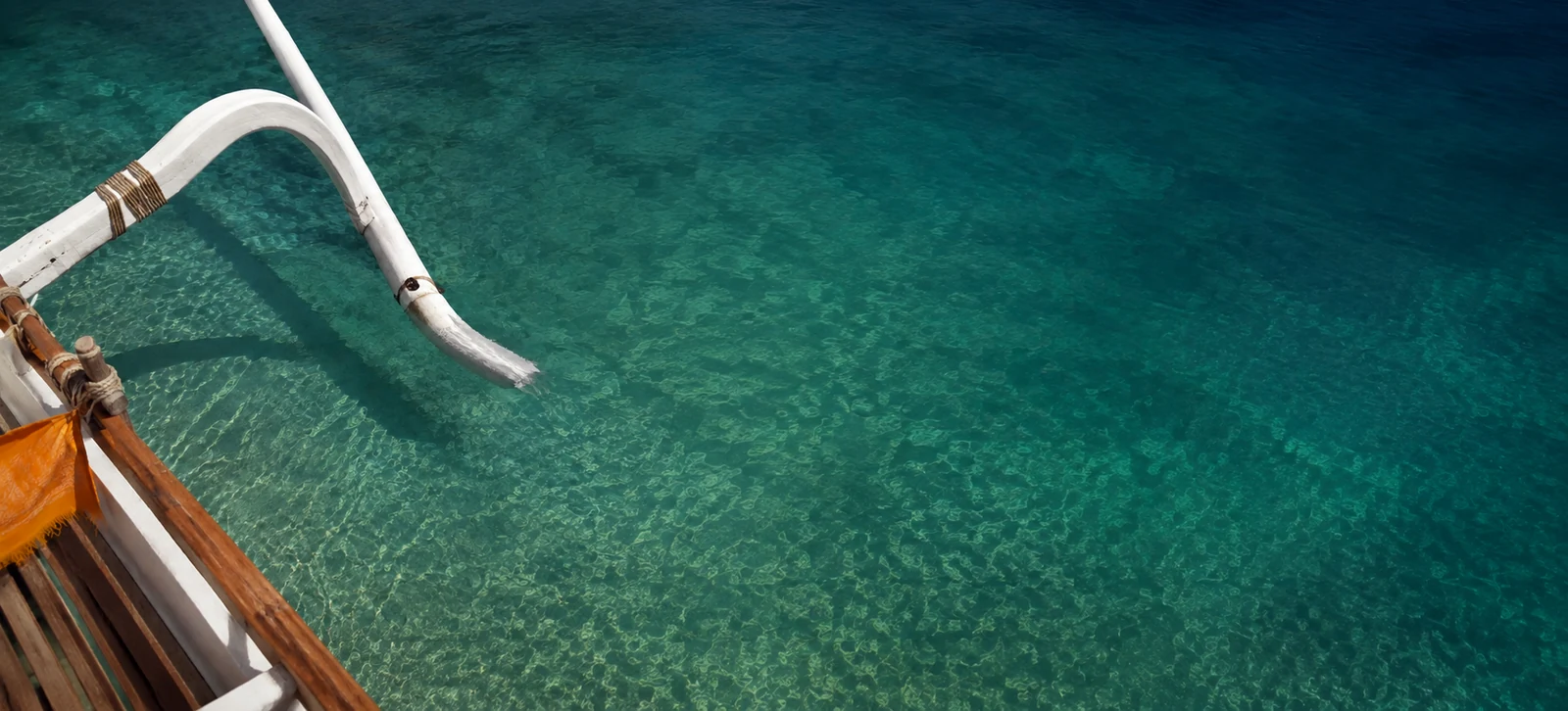 AI photographic study of a Balinese jukung on continuous crystalline sea